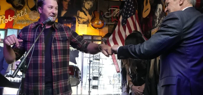 Country music star Luke Bryan gives a fist bump to Gov. Bill before Lee signed a bill Thursday, March 21, 2024, in Nashville, Tenn. Mark Humphrey/AP